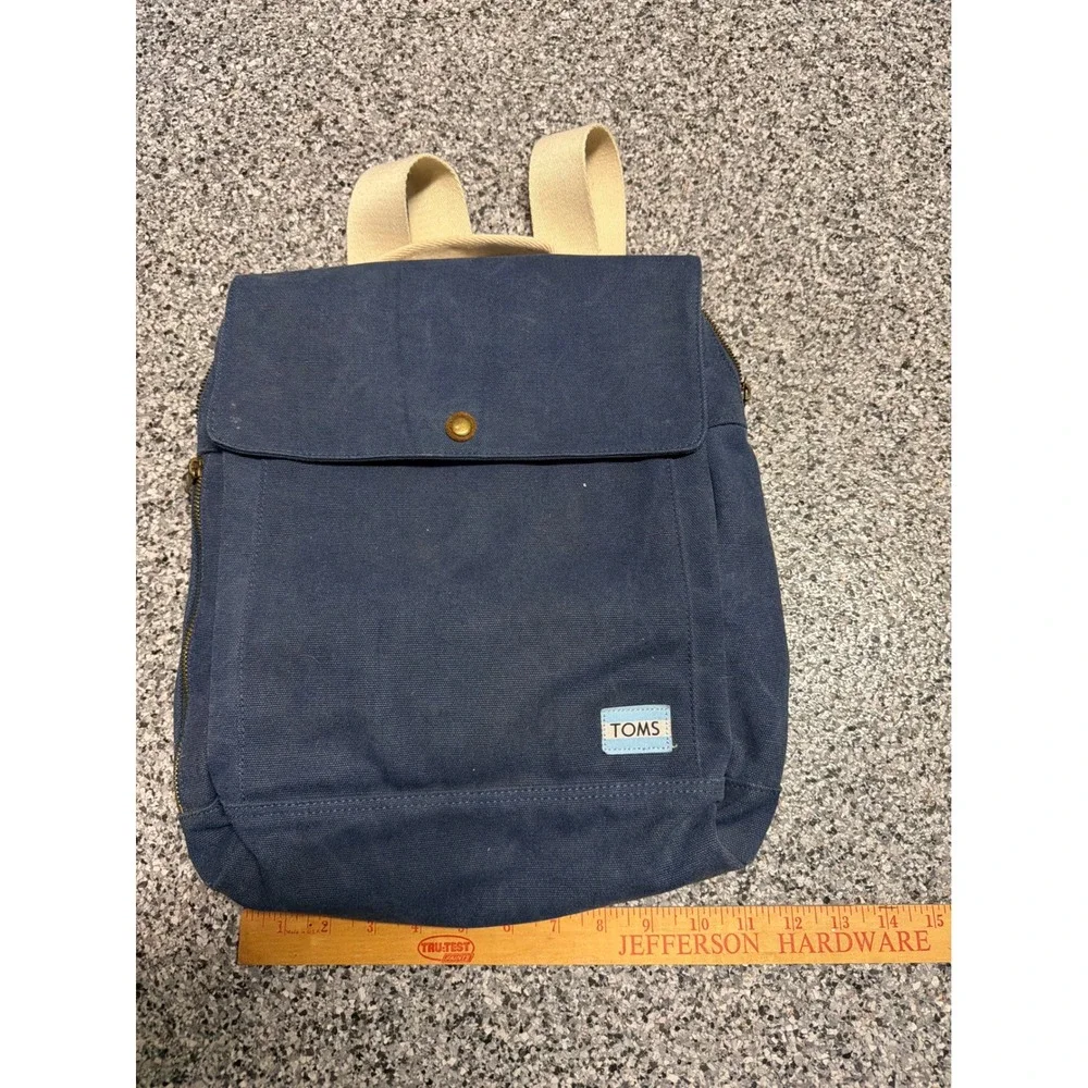 TOMS Navy Blue Canvas Backpack Adjustable Straps Brass Hardware Carpe Diem